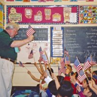 2/17/06 - Flag Day Program at Mission Educational Center for 211 students - Lion Bob Lawhon getting a rise from students as he talks about the flag.