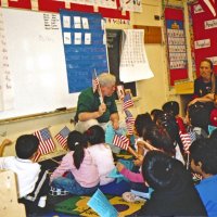 2/17/06 - Flag Day Program at Mission Educational Center for 211 students - Lion Bob Lawhon getting down close to the students while he talks about the flag.