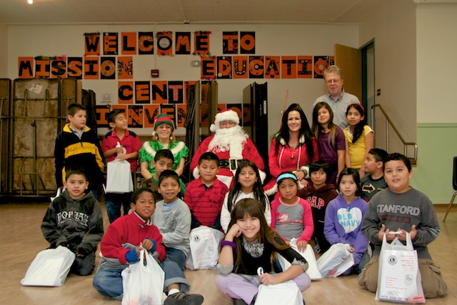 Students with Santa and his Staff