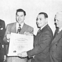1/13/51: Presentation of Charter to the Geneva-Excelsior Lions Club. L to R: John J. McDonald, Past District Governor (District 4, 1928-29); Maurice Perstein, Deputy District Governor; Charter President “Murphy” Boehme; District Governor Joseph R. Territo (4-B2); Thomas S. Neilson (4-B Past International Director (1942-44); and Jack Merchant, Past District Governor (4-B, 1949-50).