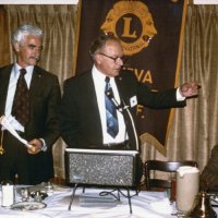 11/5/75 - District Governor Lee Shore’s Official Visitation, Granada Cafe, San Francisco - L to R: Al Gentile, Lee Shore, DG; and Joe Farrah. President Al Gentile about to present our Club banner to the District Governor.