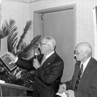 7/10/76 - Installation of Officers, Fort Mason Officers Club, San Francisco - Past International Director Bab Simontacchi, on left, reading the Life Membership Certificate just before presenting it to Al Kleinbach. Eva Bello looks on in the lower right.