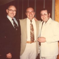 1976-1977 - District Governor Les Davis, Deputies Hank Sari, and Ron Faina