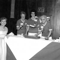 5/12/84 - District 4-C4 Convention, El Rancho Tropicana, Santa Rosa - Ladies Luncheon - L to R, behind table: Irene Tonelli, Estelle Bottarini, and Linnie Faina helping set up a function.