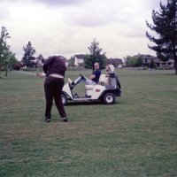 5/14/86 - District 4-C4 Convention, Santa Rosa - Golf Tournament - First event of the convention on Wednesday morning - Handfor Clews finishes a fairway shot while Dick Johnson looks on.