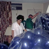 May 1987 - District 4-C4 Convention, El Rancho Tropicana, Santa Rosa - Costume Parade - L to R: Estelle & Charlie (obscured), and Frank Ferrera unpacking their grapes.