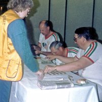 May 1987 - District 4-C4 Convention, El Rancho Tropicana, Santa Rosa - Tail Twister Contest - L to R: Dick Johnson, Charlie Bottarini, and Handford Clews “selling” change just before the Tail Twister Contest.