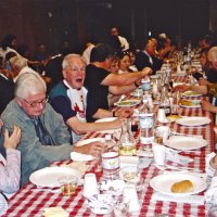2/26/05 - Recreation Center For the Handicapped, San Francisco - 23rd Annual Crab Feed - 429 attending - enjoying dinner; Ted (hands only) & Vernelle Wildenradt in lower left, and Ward Donnelly two places down shouting something.