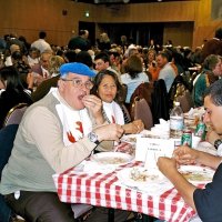 2/25/06 - 24th Annual Crab Feed at the Janet Pomeroy Center For The Handicapped - 470 attendees - Aaron (blue hat) & Jesusa Straus enjoying crab with some of their guests.