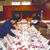 2/25/06 - 24th Annual Crab Feed at the Janet Pomeroy Center For The Handicapped - 470 attendees - Members of the Lowell High School Leos helping to set tables before the event.