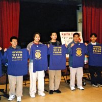 2/25/06 - 24th Annual Crab Feed at the Janet Pomeroy Center For The Handicapped - 470 attendees - Six members of the Lowell High School Leos proudly displaying their shirts after helping to set tables for the event. Handford Clews, ticket chairman, is seated on the far right.