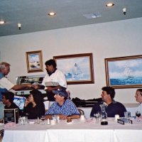 8/17/05 - Sharp Park Golf Course, Pacifica - Lion Chairman Bob Fenech (out of picture) commenting about the tournament. Standing: Lion Dick Johnson. Seated: Lion Ernie Braun, guest, Leona Wong, guest, John Jones, and Lion Bre Martinez.
