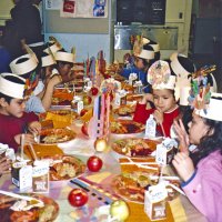 11/22/05 - Mission Educational Center, San Francisco - Students enjoying their lunch of turkey, stuffing, sweet potatoes, carrots, and cranberry sauce.