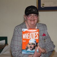8/16/17 - 68th Installation of Officers, Sharp Park Restaurant, Pacifica - Lion Sharon Eberhardt with her box of Wheaties to give her strength for the coming year.