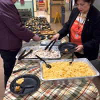 11/16/17 - Serving Thanksgiving Luncheon, Mission Educational Center - Lions Sharon Eberhardt and Zenaida Lawhon preparing luncheon plates.