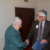 8-17-22 - 73rd Installation of Officers, Italian American Social Club - Mario Benavente, right, presenting, and congratulating, Joe Farrah on 52 years of service to the Geneva-Excelsior Lions Club.