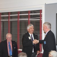 7-19-23 - Basque Cultural Center, South San Francisco - 74th Installation of Officers - PDG Mario Benavente, center, congratulates Steve Martin for accepting the duties of President, while outgoing President Bob Lawhon looks on.
