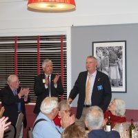 7-19-23 - Basque Cultural Center, South San Francisco - 74th Installation of Officers - Officially installed, Steve Martin, right, accepts applause from the gathering. To his left are PDG Mario Benavente and outgoing President Bob Lawhon.