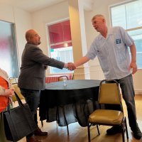 6-19-24 at regular meeting at the Italian American Social Club, San Francisco - Lion President Stephen Martin thanking Jorge Leiva for attending and letting us know how donations are spent.