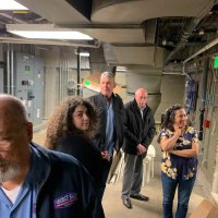 3-20-24 - Clinic by the Bay Tour, 35 Onondaga Ave., San Francisco - In the dungeon at the Clinic are, l to r, George Salet, our tour guide Iliana Escudero, Steve Martin, Bill Graziano, Olga Ayala, Clinic Director, and Sharon Eberhardt.