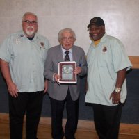 3-20-24 - Italian American Social Club, San Francisco - District Governor’s Visitation, Joe Farrah’s 58 Year Recognition - 1st Vice District Clayton Jolley, Lion Joe Farrah, and District Governor Kevin Guess pose after recognizing Lion Joe’s 58 years of service to our Club and Lionism.