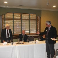 8-21-24 - 75th Installation of Officers, Basque Cultural Center, South San Francisco - Standing are Mario Benavente giving Joe Farrah his charge as Secretary. Seated are, near table: Kathy Salet; head table, L to R: Bill Graziano, Stephen Martin, and Rose Benavente.