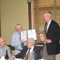 8-21-24 - 75th Installation of Officers, Basque Cultural Center, South San Francisco - Stephen Martin, right, with Bob Lawhon displaying his two albums and Past President’s plaque just received. Seated are Bill Graziano and Joe Farrah.