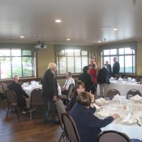 8-21-24 - 75th Installation of Officers, Basque Cultural Center, South San Francisco - Talking are, L to R, near table: Sharon Eberhardt and Soonae Kang; left table: Bill Britter, Joe Farrah, Mike Foti, and Zenaida Lawhon; back corner: George Leeds, Eleanor Britter, Bob Lawhon, Bill Graziano, and Stephen Martin.