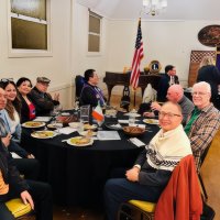 11-19-25 - Photo by Gregory Leung - SFCCLC meting hosted by the Geneva-Excelsior Lions, Italian American Social Club, San Francisco - One of the tables at the meeting; Last on the left are Lions Zenaida & Bob Lawhon; last on the right are Lions Lyle Workman and Bill Graziano.