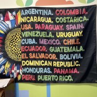 12-18-24 - 43rd Annual Lions Christmas with Santa at the Mission Education Center with Los Bomberos Firefighters - Banner which depicts the various countries where the children in the Mission Educational Center come from.