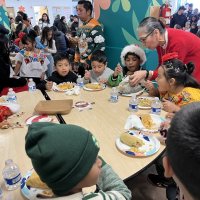 12-18-24 - 43rd Annual Lions Christmas with Santa at the Mission Education Center with Los Bomberos Firefighters - Students enjoying lunch prior to their visit with Santa.