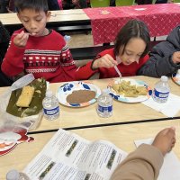 12-18-24 - 43rd Annual Lions Christmas with Santa at the Mission Education Center with Los Bomberos Firefighters - Students enjoying lunch prior to their visit with Santa.