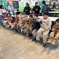 12-18-24 - 43rd Annual Lions Christmas with Santa at the Mission Education Center with Los Bomberos Firefighters - The first class patiently waiting for Santa.